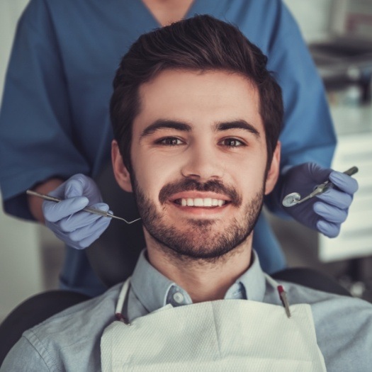 Man smiling in dental chair