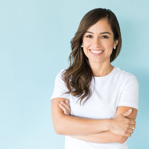Happy, smiling woman wearing white t-shirt