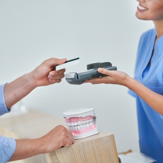 Dental patient swiping their credit card