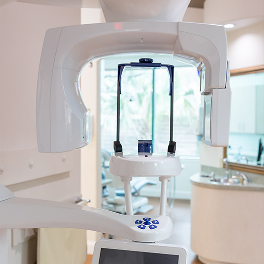 Cone beam scanning machine against wall of dental office