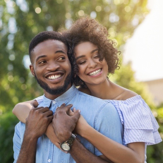 Man and woman hugging outdoors