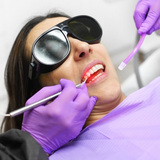 Dental patient receiving laser treatment for gum disease