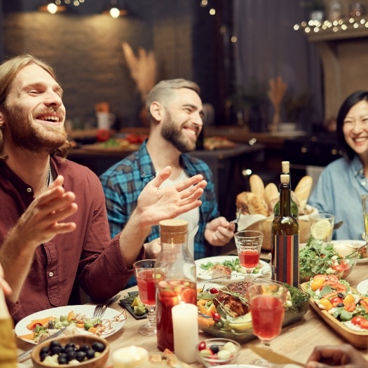 Group of young adults at a dinner table