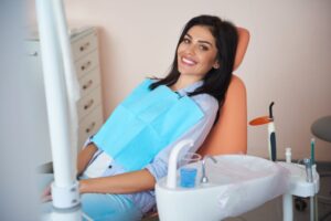 Happy dental patient in treatment chair